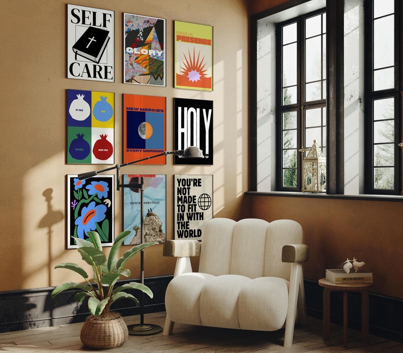 May include: A living room interior with a white armchair, a floor lamp, and a wall decorated with colourful posters. The posters feature phrases like "Self Care", "Glory", "New Mercies", "Holy", and "You're Not Made To Fit In With The World".