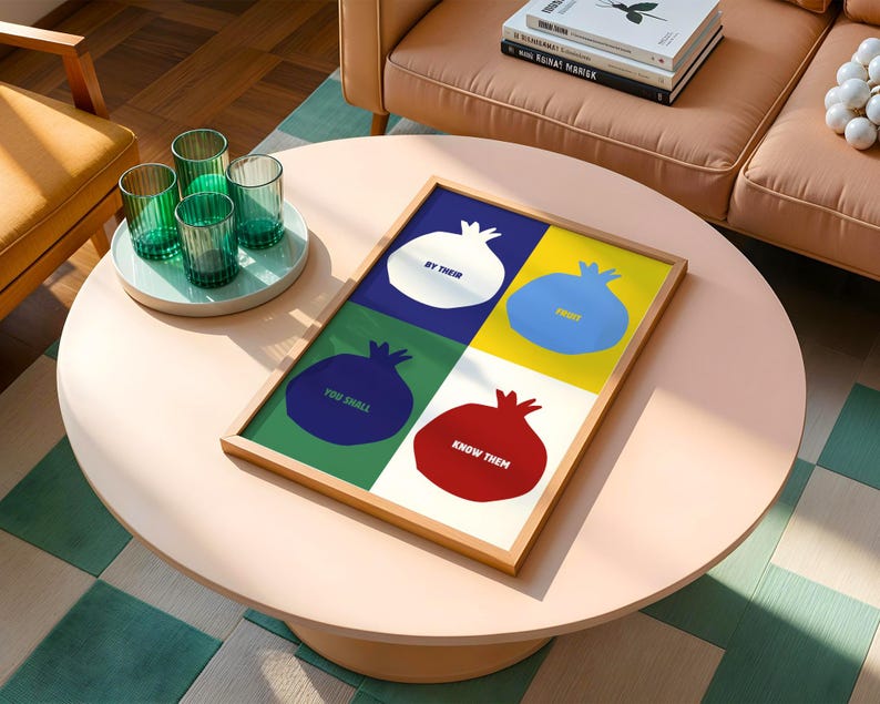 May include: A framed print with a colourful geometric design featuring four pomegranates, each with a different colour and a phrase. The phrases are "By Their", "Fruit", "You Shall", and "Know Them Then".