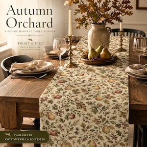 May include: A cream-coloured table runner featuring a repeating pattern of brown and green pears, apples, oak leaves, and acorns. The text on the image reads Autumn Orchard, Vintage Harvest Table Runner, Frost & Fig, and Cotton Twill & Polyester.