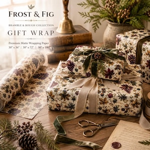 May include: Frost & Fig Bramble & Bough Collection gift wrap featuring a cream-colored matte paper with a botanical pattern of dark leaves, berries, and pinecones. The paper is available in 30" x 36", 30" x 72", and 30" x 180" sizes.