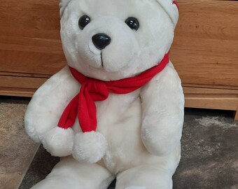 White christmas bear with santa hat and red scarf