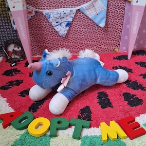 Unicornio azul cielo en adopción