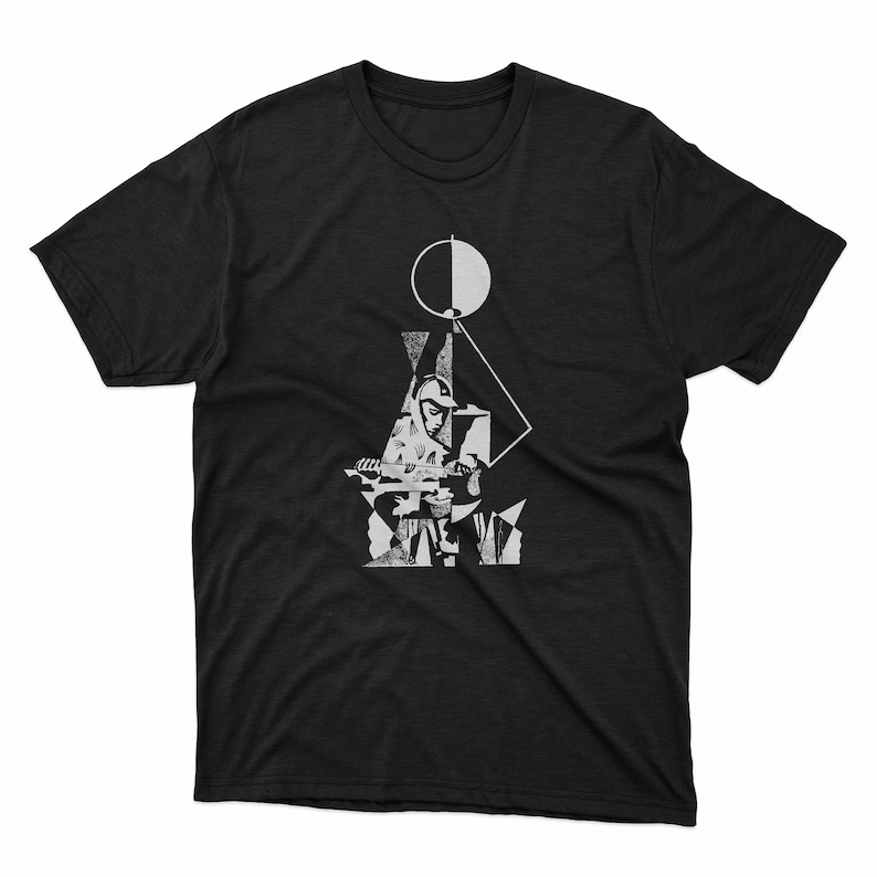 May include: Black t-shirt featuring a white graphic design. The design includes geometric shapes, a circle, and a figure playing an instrument. The graphic is a stylized, artistic representation.