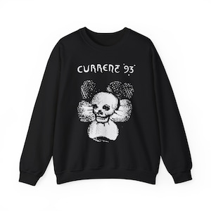 May include: Black sweatshirt with a white skull and flower graphic and the text "CURRENT 93" printed on the front.