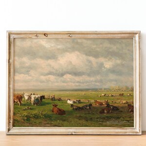Pastoral scene featuring cows in a lush green field under a cloudy sky