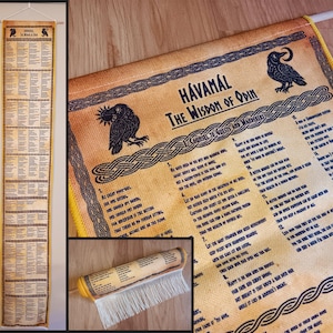 May include: A tan-colored wall hanging with the text "Hávamál The Wisdom of Odin" and illustrations of ravens. The text is in black, and the edges are trimmed with a yellow border. The hanging is displayed vertically.
