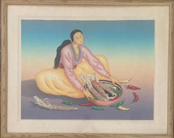 May include: A woman in a pink and yellow dress sits on the ground with a bowl of corn on the cob. She is holding a piece of corn in her hand. There are green and red peppers scattered around the bowl.