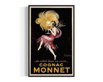 May include: Vintage Cognac Monnet advertisement poster. The artwork features a woman in a flowing red and pink dress, holding a glass of cognac. The poster has a black background with gold lettering and the text "...du soleil dans un verre..." and "COGNAC MONNET".
