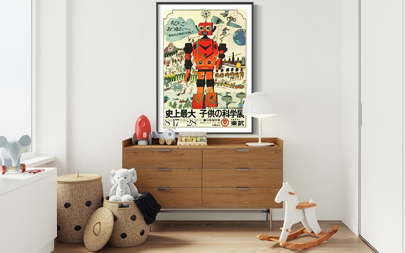 May include: A vintage poster featuring a red robot with a cityscape background. The poster is framed and hanging on a wall in a child's room. The text on the poster reads "History's Greatest Children's Science Exhibition 8.17-28 Tokyo"