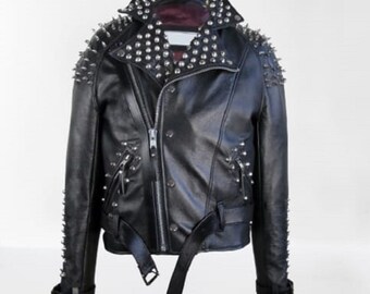 May include: Black leather jacket with silver studs on the collar, shoulders, and sleeves. The jacket has a zipper closure and a belt at the waist.