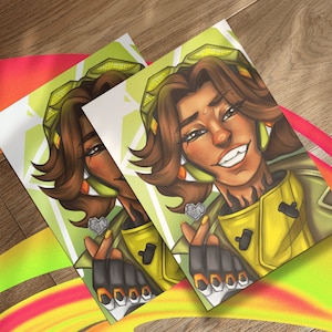 May include: A digital illustration of a person with brown hair and green eyes. They are wearing a yellow and green jacket with a heart-shaped charm on their finger. The background is a green and yellow gradient.