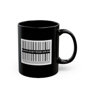 May include: Black ceramic mug with a white barcode design and the text "BLACK IS MY RIDE OR DIE". The mug has a curved handle and a glossy finish. The mug is a standard 325 ml size.