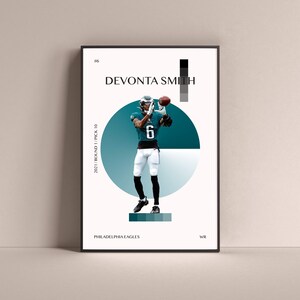 May include: A digital illustration of American football player DeVonta Smith wearing a green and white Philadelphia Eagles uniform. The illustration is set against a white background with a teal and light blue circle behind the player. The text "#6", "DEVONTA SMITH", "2021/ROUND 1/PICK 10", "PHILADELPHIA EAGLES", and "WR" are also included in the illustration.