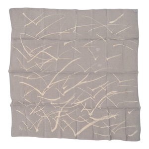 May include: A square, light gray scarf with a cream-colored abstract bird design. The scarf is folded and has a subtle sheen. The design features multiple bird-like shapes in a scattered pattern.