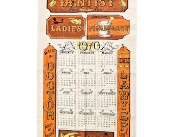 May include: A vintage 1970 calendar tea towel with a white background and orange and yellow text. The calendar features the months of the year with the days of the week and numbers. The towel also features various signs with text such as "Dentist", "Pharmacy", "Ladies", "Gents", "Doctor", "Lawyer", and "Honest".