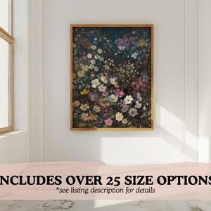 May include: A framed print of a floral arrangement featuring a variety of flowers in shades of pink, white, and purple. The flowers are arranged in a dense cluster, creating a vibrant and colourful display. The background is a dark, almost black, colour, which provides a striking contrast to the bright flowers.