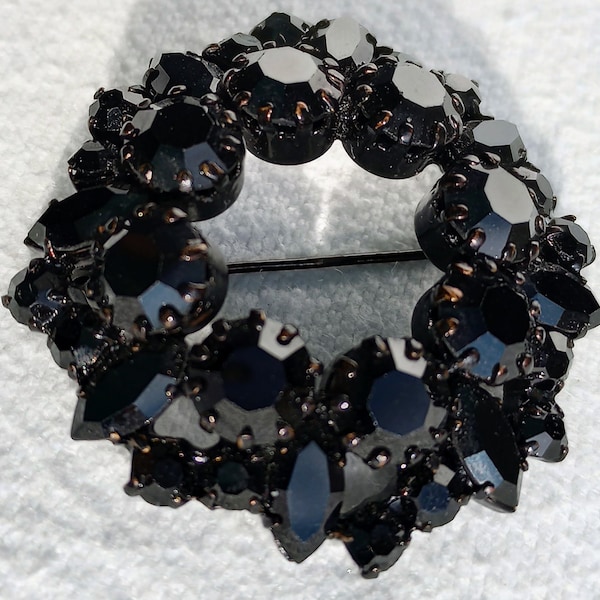 Vintage Austrian Wreath Brooch. Two inches. Black stones in bronze tone setting. Japanned setting. Made in Austria mark. Free shipping.