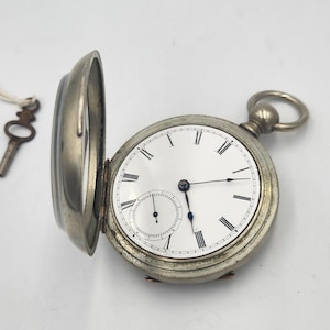 1876 American Waltham Watch Co. Pocket Watch With Winding Key in Silveroid Case