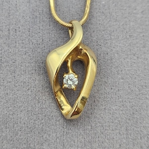 10k Yellow Gold Diamond Pendant on 14k Yellow Gold Rope Chain