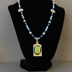 Dichroic pendant yellow & blue on decorative silver mounting plate necklace