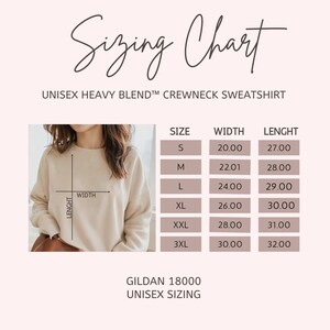 May include: Unisex sizing chart for a Gildan 18000 crewneck sweatshirt. The chart shows the width and length measurements in inches for sizes S, M, L, XL, XXL, and 3XL.