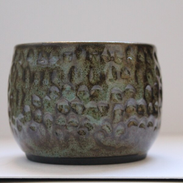 carved ceramic cup