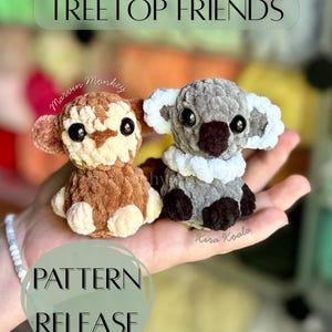 May include: A hand holds two crocheted toy animals: a brown monkey and a grey koala. The koala has white trim. Text above reads "Treetop Friends" and below "Pattern Release".