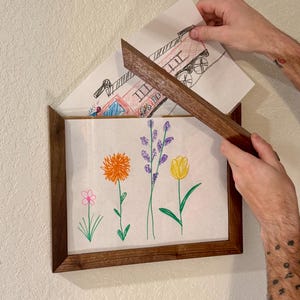 May include: A handmade, wooden serving tray with a natural finish. The tray features a rectangular shape with raised edges and integrated handles. The wood grain is visible, showcasing the tray's rustic charm. Dimensions: 18 inches long, 12 inches wide, and 2 inches high.