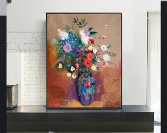 May include: A framed floral still life painting. A vibrant bouquet of colorful flowers, including red, pink, and white blooms, is arranged in a blue vase with ornate details. The background features warm tones of brown and red.