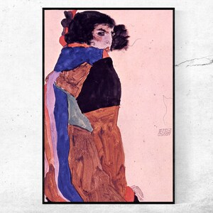 May include: Framed print of a portrait in profile. The artwork uses browns, blues, and purples, with a black background. The person is wearing a scarf and a dark garment. The artwork is displayed in a black frame.