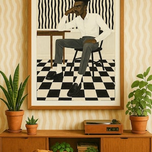 May include: A framed art print depicts a person in a white shirt and gray pants seated at a table. The background features a black and white checkered floor and a striped wall. A wooden cabinet with plants and a dog in front.