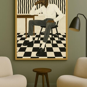 May include: A framed artwork depicts a person seated at a table, wearing a white shirt and gray pants. The background features a black and white checkered floor and a striped wall. The artwork is displayed in a room with modern furniture.