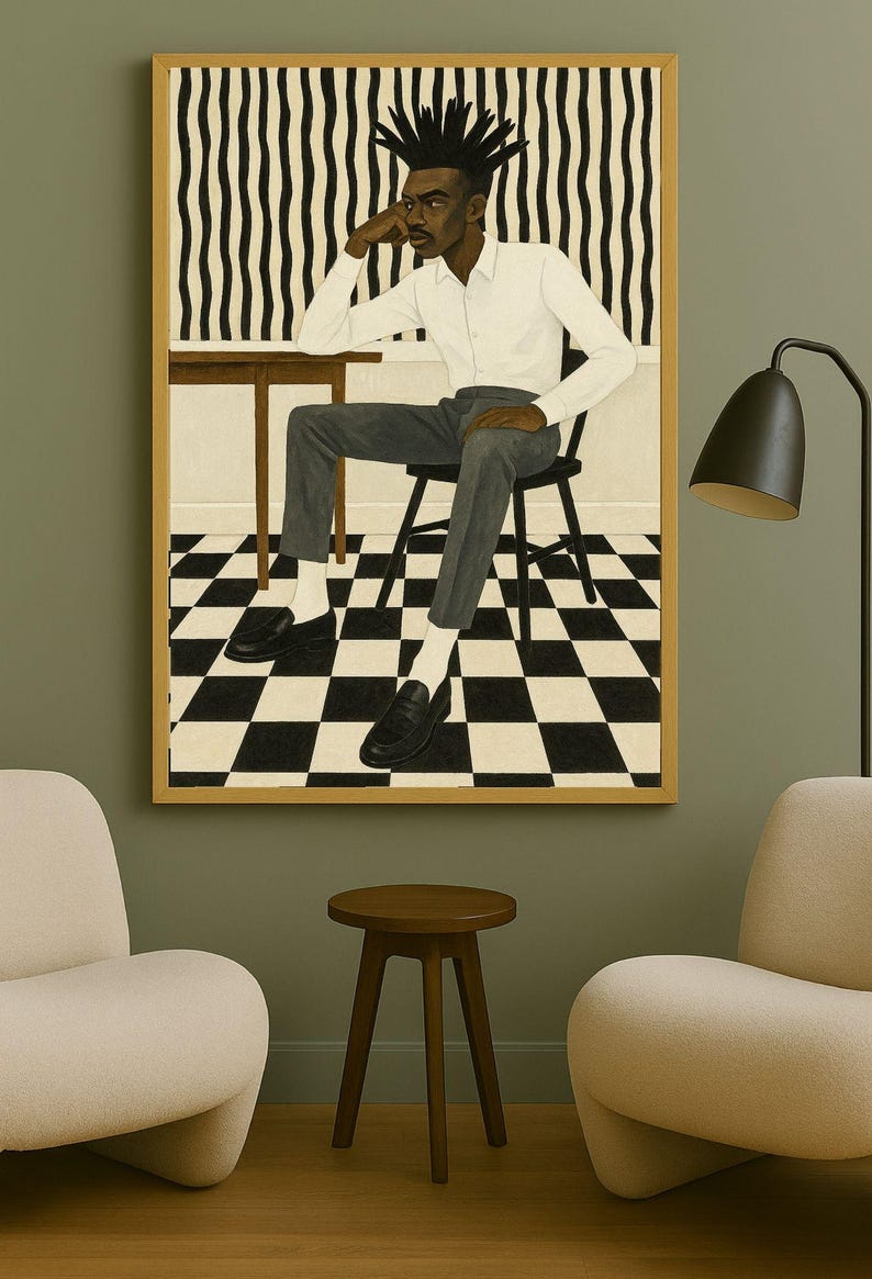 May include: A framed artwork depicts a person seated at a table, wearing a white shirt and gray pants. The background features a black and white checkered floor and a striped wall. The artwork is displayed in a room with modern furniture.