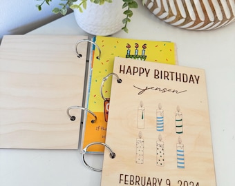 May include: A wooden birthday card with a light wood background. The card has a title that says "Happy Birthday Jensen" and a date that says "February 9, 2024". The card has six candles with different patterns on them.