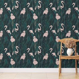 May include: Wallpaper featuring a repeating pattern of pink flamingos and tropical leaves in shades of green and teal. A wooden chair with a white vase holding dried flowers is in the foreground. The wallpaper creates a vibrant, nature-inspired aesthetic.