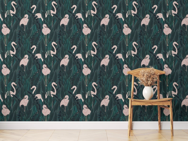 May include: Wallpaper featuring a repeating pattern of pink flamingos and tropical leaves in shades of green and teal. A wooden chair with a white vase holding dried flowers is in the foreground. The wallpaper creates a vibrant, nature-inspired aesthetic.