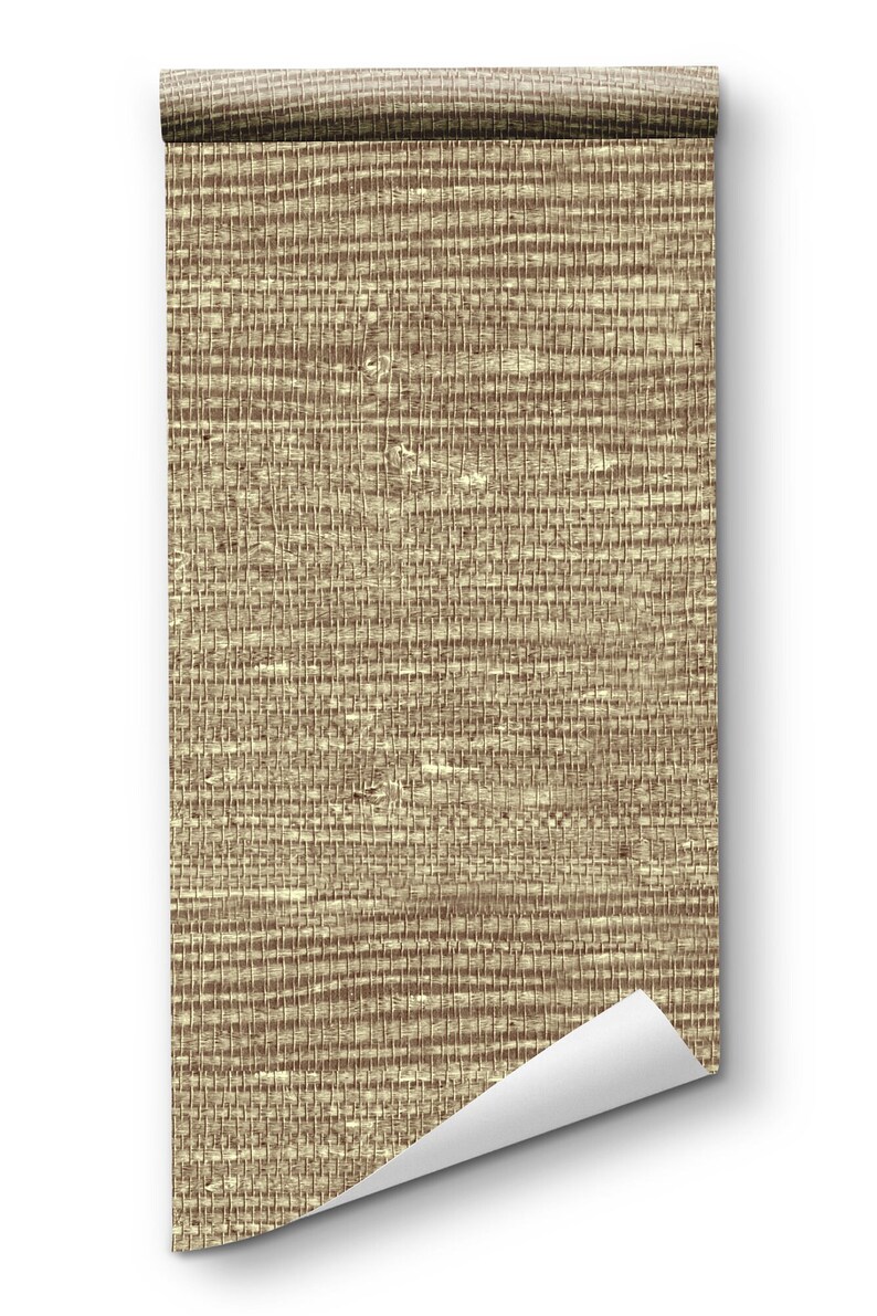 May include: A roll of beige and brown textured wallpaper with a woven pattern. The wallpaper is rolled up and the end is curled up.