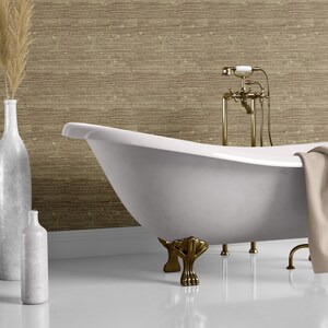 May include: A white clawfoot bathtub with gold-toned fixtures and feet. The bathtub is in a bathroom with a brown textured wall and a white baseboard.