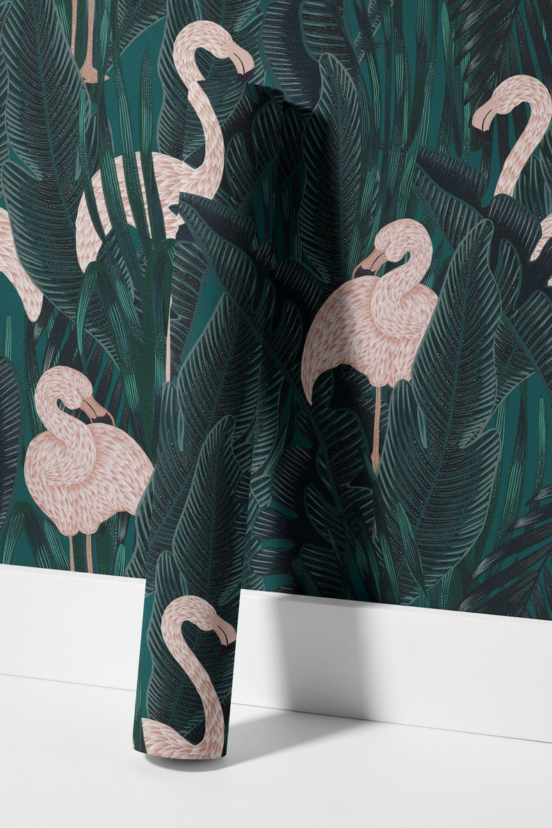 May include: Wallpaper featuring a repeating pattern of pink flamingos amidst lush, dark green tropical foliage. The design includes large, detailed leaves and a textured appearance, creating a vibrant and exotic aesthetic.