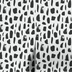 May include: Black and white abstract pattern wallpaper with a repeating pattern of brushstrokes. The wallpaper has a white background with black brushstrokes of various shapes and sizes.