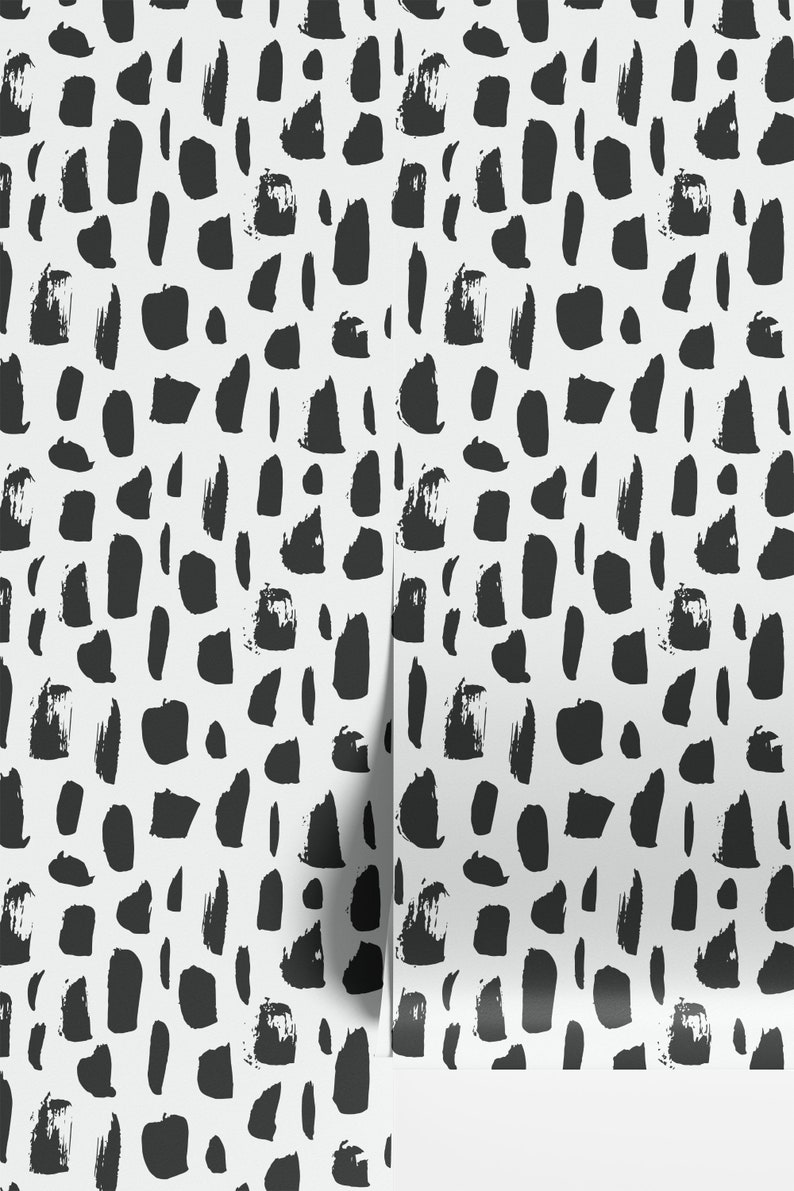 May include: Black and white abstract pattern wallpaper with a repeating pattern of brushstrokes. The wallpaper has a white background with black brushstrokes of various shapes and sizes.