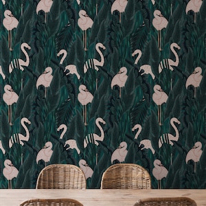 May include: Wallpaper featuring a repeating pattern of pink flamingos amidst dark green tropical foliage. The design includes large, stylized leaves and the birds are in various poses. The image also shows a wooden table and wicker chairs.