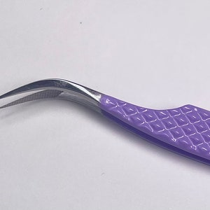 May include: Purple lash tweezers with a curved tip and a textured handle.