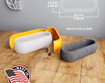 May include: A white and yellow oval-shaped container with dimensions of 10 cm x 25 cm x 6 cm (3.94 in x 9.84 in x 2.36 in). A gray oval container is also shown. The image includes the text "MADE IN USA".