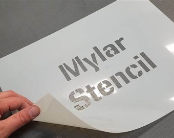 May include: A white Mylar stencil with the words "Mylar Stencil" printed in gray.