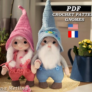 May include: PDF crochet pattern for two gnomes, one pink and one blue, with a white beard. The pattern is available in English and French.