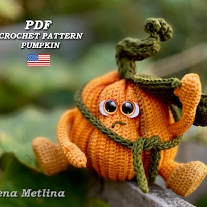 May include: Crochet pattern PDF for a cute orange pumpkin with green leaves and a sad face. The pattern is available for download.
