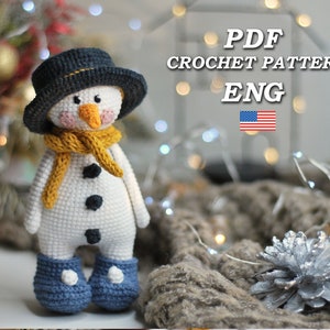 May include: Crochet pattern for a snowman amigurumi toy. The pattern is in English and includes instructions for making a snowman with a black hat, yellow scarf, and blue boots. The pattern is available as a PDF download.