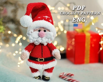 May include: Crocheted Santa Claus amigurumi doll wearing a red suit with white trim, a white beard, and a red hat with white pom-pom. PDF crochet pattern in English.