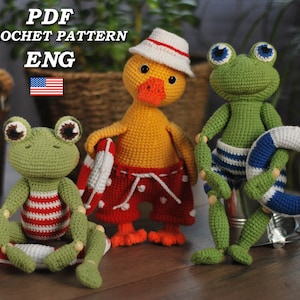 May include: Crochet pattern PDF for a yellow duck and two green frogs wearing swimsuits and holding life preservers. The pattern is in English.